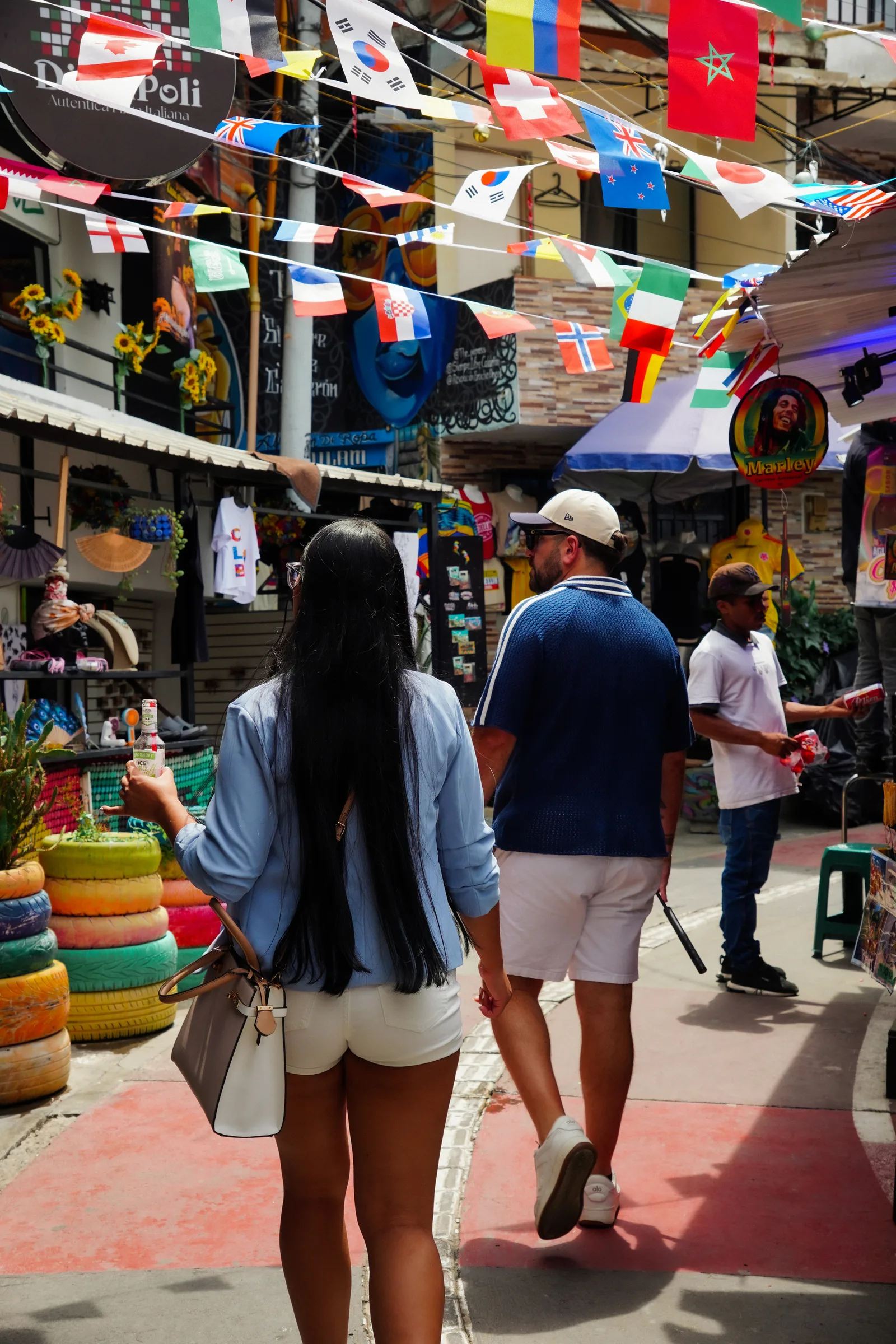 Comuna 13's flag-lined street market in Medellin
