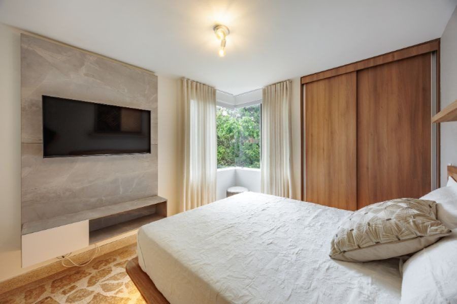 Bedroom with TV panel at Balcony apartment, Medellin