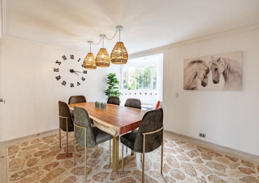 Dining table with horse artwork at Balcony apartment, Medellin
