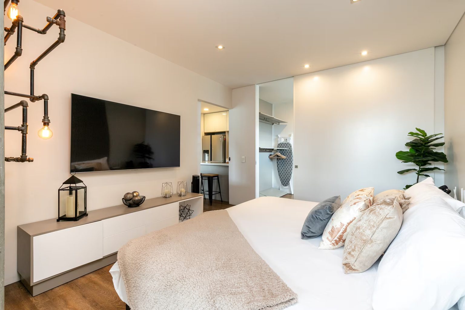 Bedroom with large TV at Energy 1201