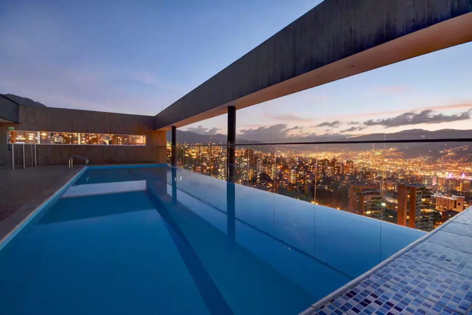 Rooftop pool at dusk with city lights, Energy 1201, Medellin