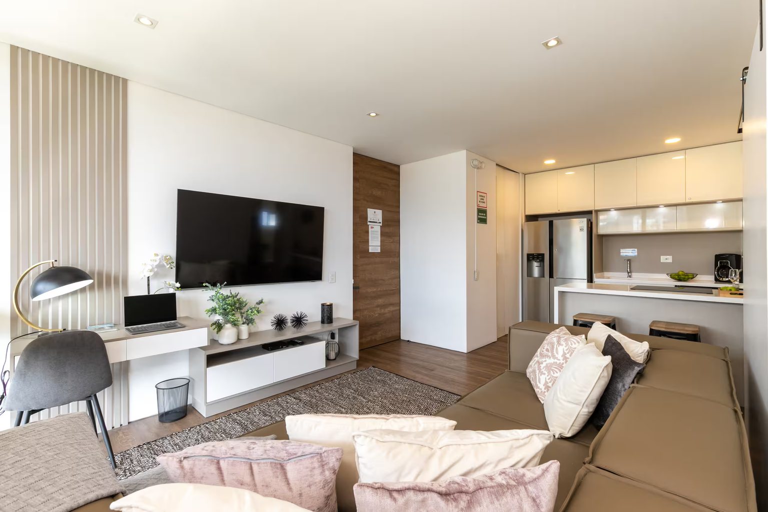 Open plan loft with desk and kitchen at Energy 1201