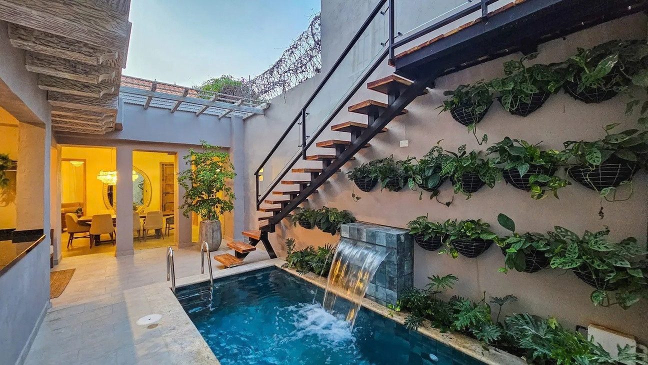 Courtyard pool with waterfall and green wall at Iconic Center, Cartagena