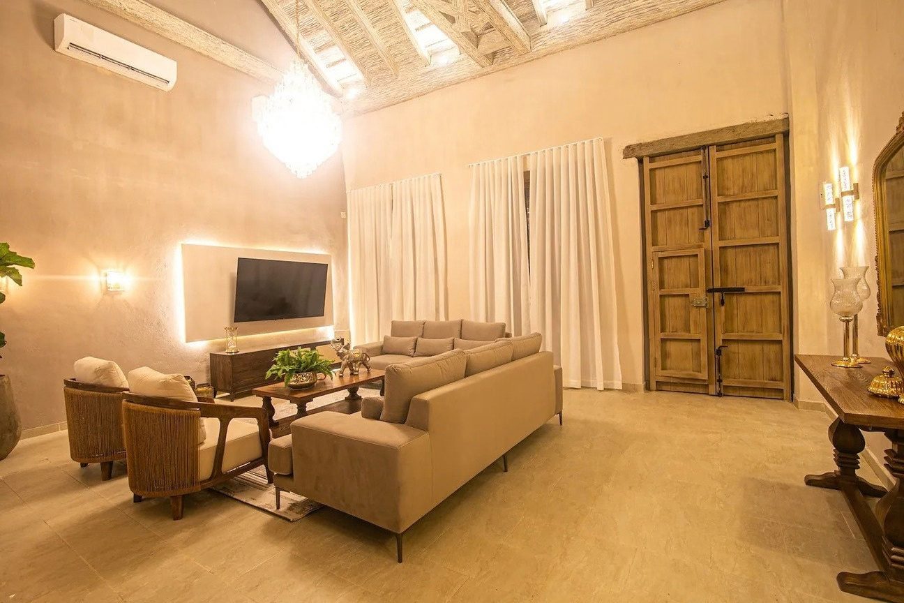 Double height living room with colonial door at Iconic Center