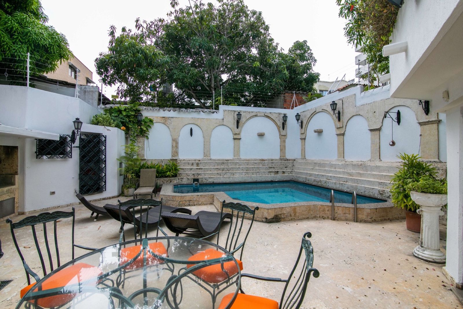 Outdoor dining table on the pool patio at Mar House, Cartagena