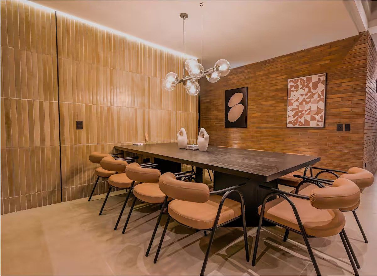 Dining area with brick wall and pendant lamp at Provenza 3, Medellin