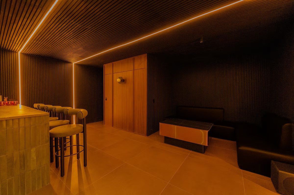 Dark lounge bar with stools at Provenza 3, Medellin