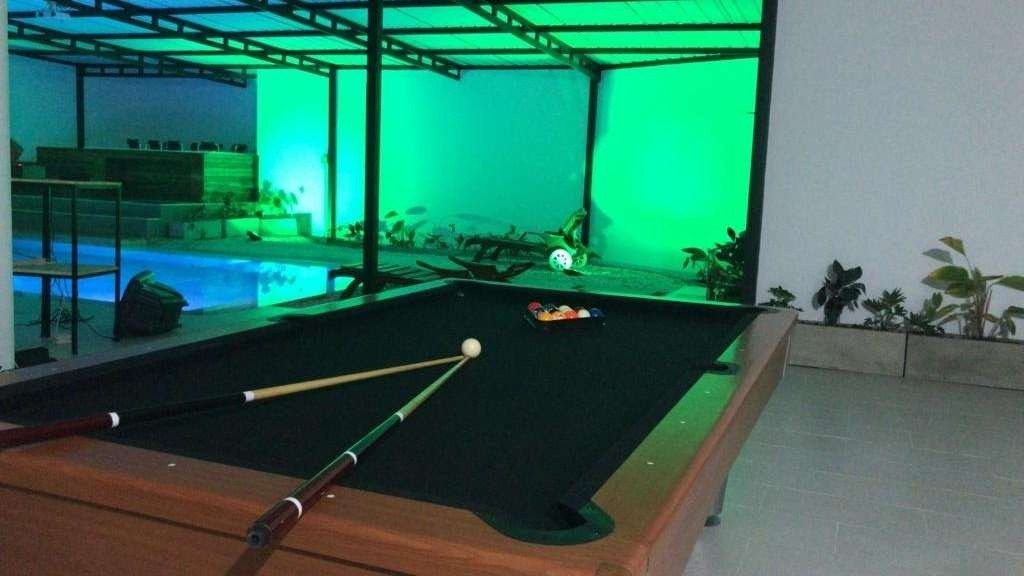 Billiards table in the game area of White Mansion, Medellin